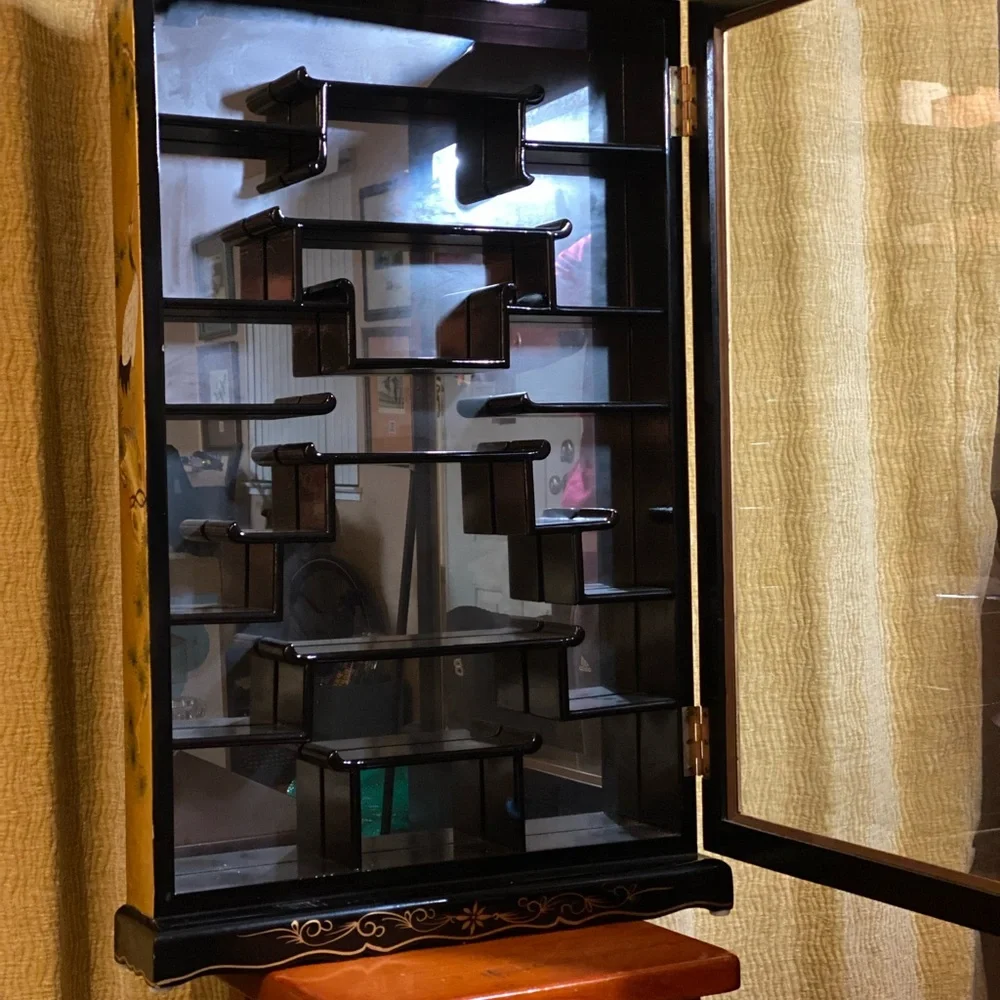 Elegant Black and Gold Wall Display Cabinet. Asian style decorated